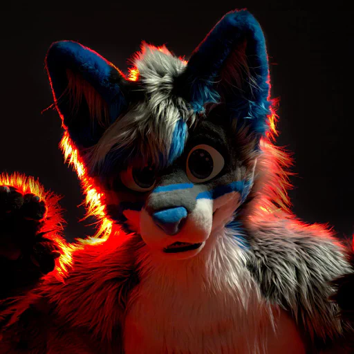 Close-up photo of a wusky fursuiter with light gray fur and blue stripes, both hands raised as if to pounce on the camera.